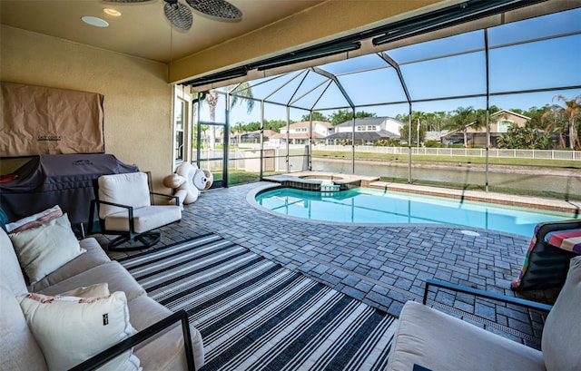 3033 Stonegate Falls Dr, Land O Lakes, FL 34638 - view of pool with a residential view, a ceiling fan, a pool with connected hot tub, a patio area, and a lanai