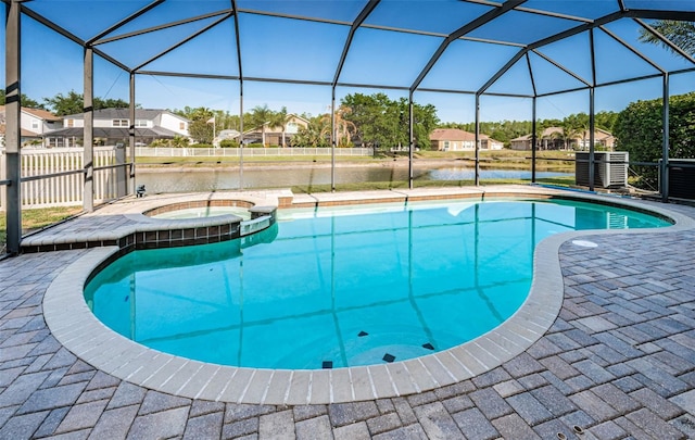 3033 Stonegate Falls Dr, Land O Lakes, FL 34638 - pool with a lanai, an in ground hot tub, a residential view, and a patio