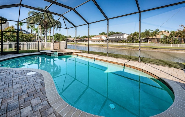 3033 Stonegate Falls Dr, Land O Lakes, FL 34638 - view of swimming pool with a water view, a residential view, a pool with connected hot tub, a patio area, and a lanai