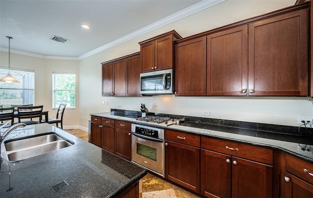 3033 Stonegate Falls Dr, Land O Lakes, FL 34638 - kitchen featuring a sink, stainless steel appliances, pendant lighting, crown molding, and visible vents