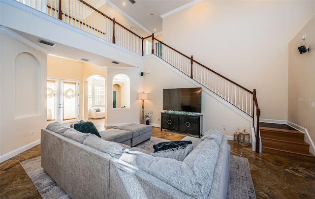 3033 Stonegate Falls Dr, Land O Lakes, FL 34638 - living room with visible vents, a towering ceiling, arched walkways, ornamental molding, and stairs