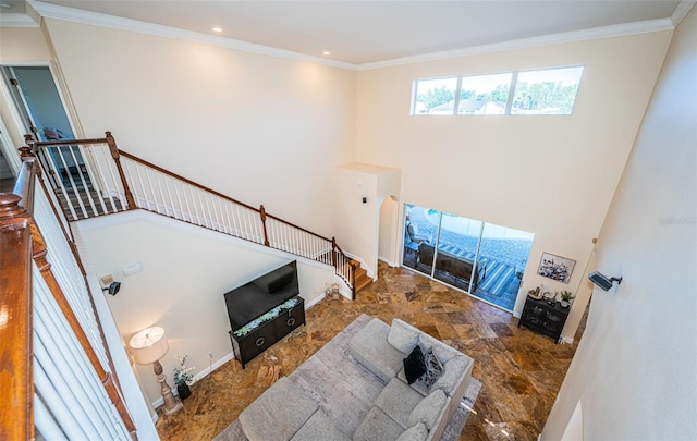 3033 Stonegate Falls Dr, Land O Lakes, FL 34638 - living room featuring crown molding, a towering ceiling, stone finish floor, and recessed lighting