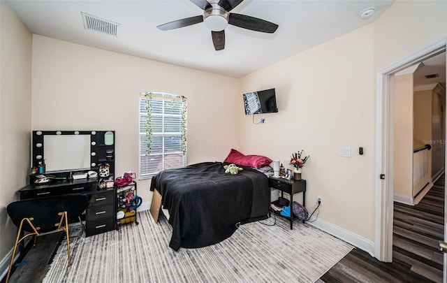 3033 Stonegate Falls Dr, Land O Lakes, FL 34638 - bedroom with a ceiling fan, visible vents, wood finished floors, and baseboards