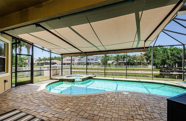3033 Stonegate Falls Dr, Land O Lakes, FL 34638 - view of swimming pool featuring a pool with connected hot tub, a patio, a lanai, and fence