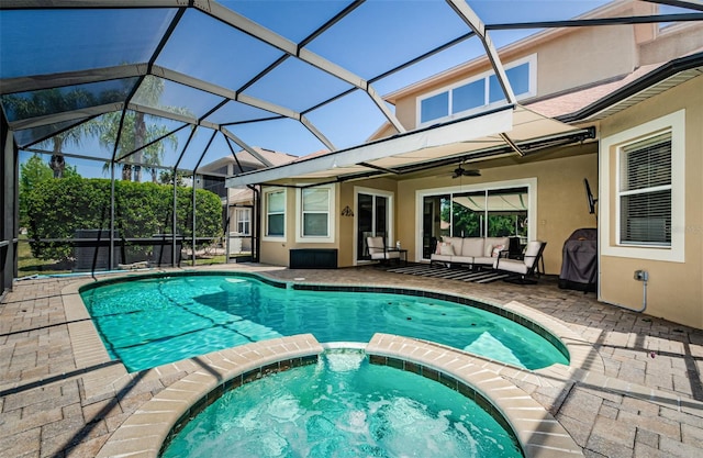 3033 Stonegate Falls Dr, Land O Lakes, FL 34638 - view of swimming pool featuring a pool with connected hot tub, a patio, and a ceiling fan