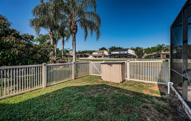 3033 Stonegate Falls Dr, Land O Lakes, FL 34638 - view of yard with a fenced backyard, a lanai, and a residential view