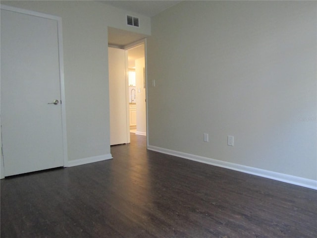 3102 W Horatio St Unit 12, Tampa, FL 33609 - unfurnished bedroom with dark wood-style floors and baseboards