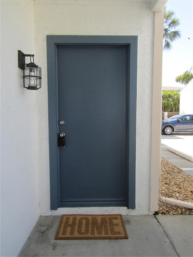 3102 W Horatio St Unit 12, Tampa, FL 33609 - doorway to property with stucco siding