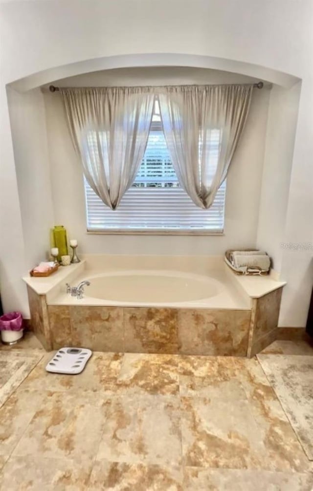 bathroom featuring a garden tub