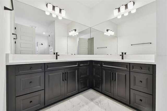 17245 Savory Mist Cir, Bradenton, FL 34211 - bathroom with double vanity, a sink, marble finish floor, and a stall shower