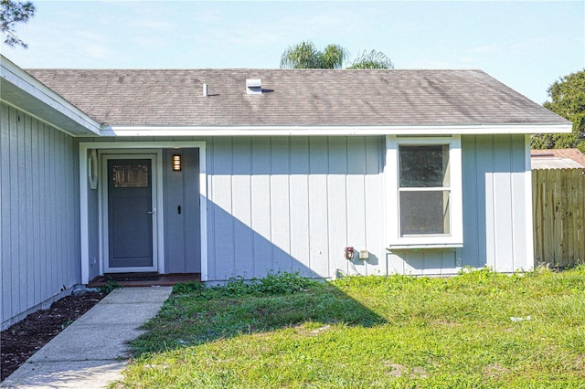 3426 Somerset Ave, Deltona, FL 32738 - property entrance featuring fence, a lawn, and a shingled roof