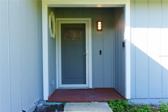 3426 Somerset Ave, Deltona, FL 32738 - property entrance with board and batten siding
