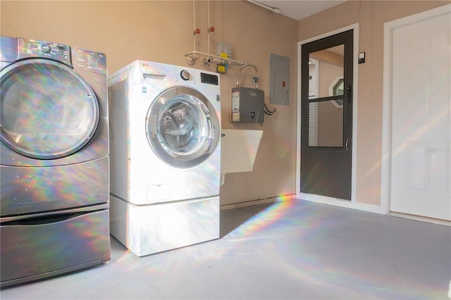 3426 Somerset Ave, Deltona, FL 32738 - clothes washing area featuring washer and clothes dryer, electric panel, and laundry area
