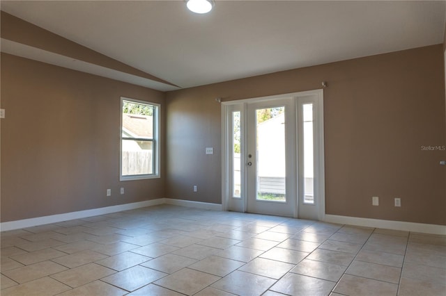 3426 Somerset Ave, Deltona, FL 32738 - unfurnished room with vaulted ceiling, baseboards, and light tile patterned floors