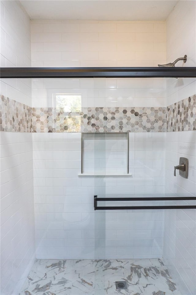3426 Somerset Ave, Deltona, FL 32738 - full bathroom featuring marble finish floor and a stall shower