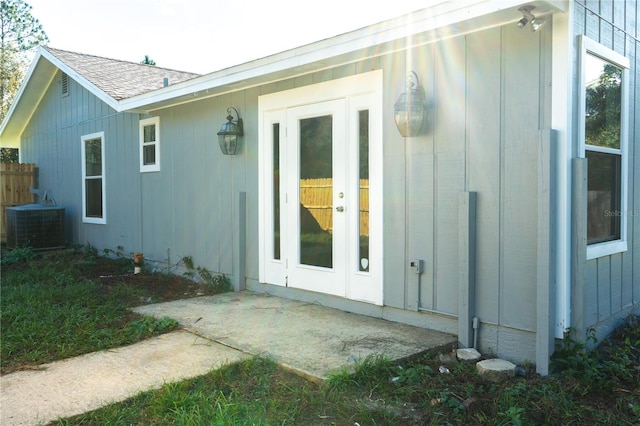 3426 Somerset Ave, Deltona, FL 32738 - back of property featuring board and batten siding and central AC unit