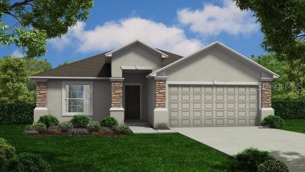 view of front facade with stucco siding, stone siding, a garage, concrete driveway, and a front yard
