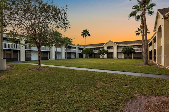 5245 W Irlo Bronson Memorial Hwy Unit 113, Kissimmee, FL 34746 - view of front facade with a lawn
