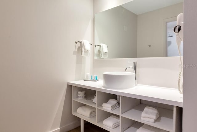 5245 W Irlo Bronson Memorial Hwy Unit 113, Kissimmee, FL 34746 - bathroom featuring vanity and baseboards