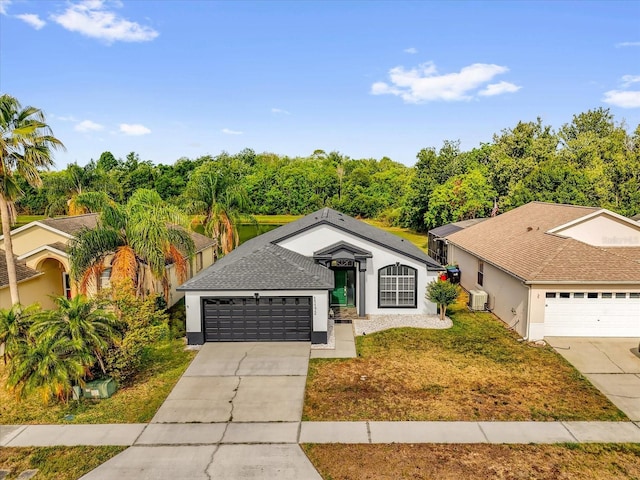 ranch-style house with an attached garage, central AC, a front lawn, stucco siding, and driveway