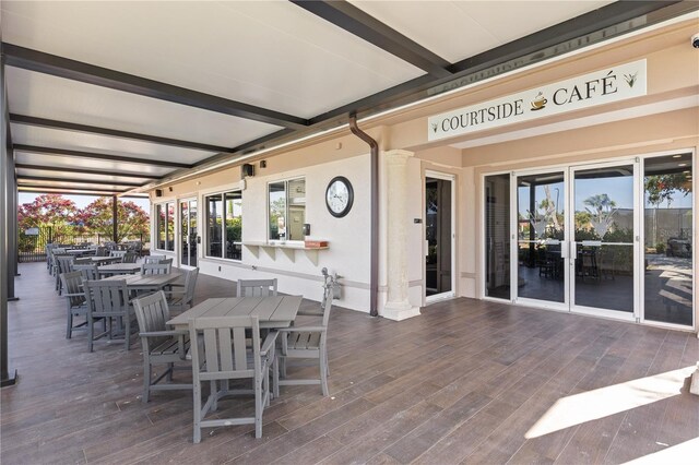 view of patio / terrace featuring a wooden deck and outdoor dining area