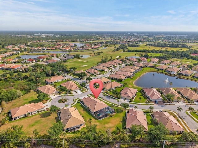 aerial view featuring a residential view, a water view, and golf course view