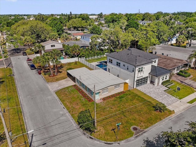 birds eye view of property with a residential view