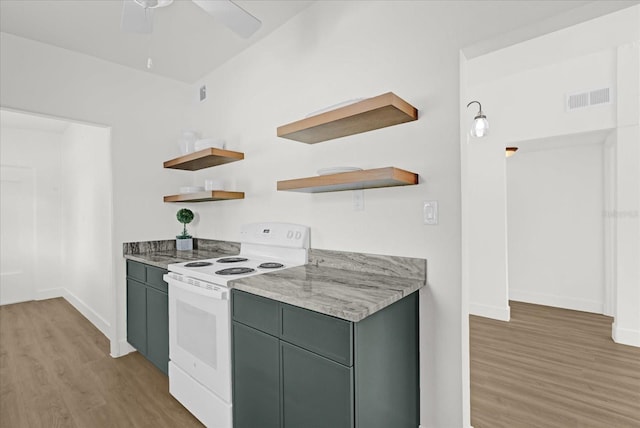kitchen with open shelves, white range with electric cooktop, light wood-style flooring, baseboards, and visible vents