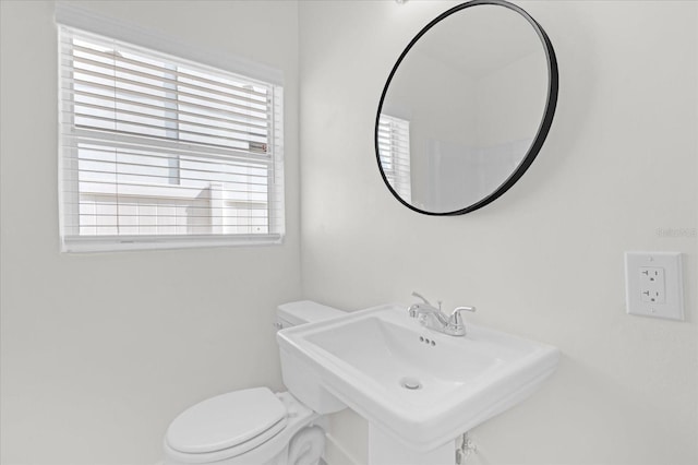 half bath with a sink and toilet