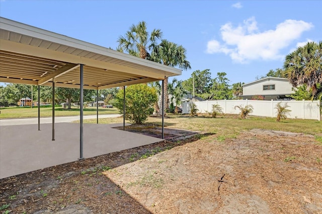 view of yard featuring a patio area and fence