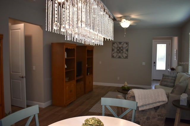 2735 Lavandula Ct, North Port, FL 34289 - living room with baseboards, a ceiling fan, and wood finished floors