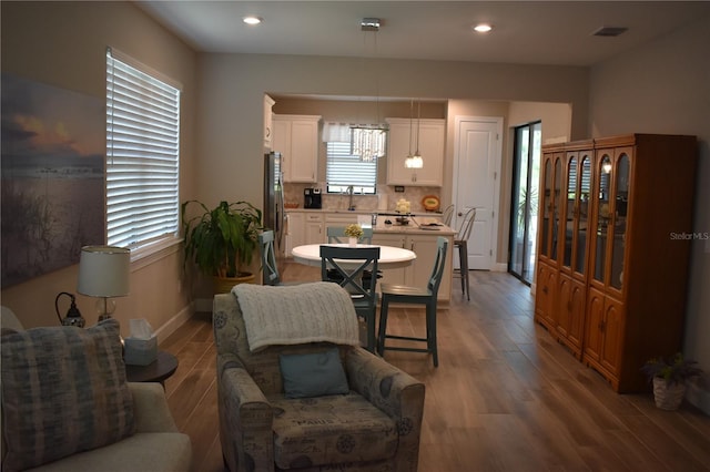 2735 Lavandula Ct, North Port, FL 34289 - dining area featuring visible vents, wood finished floors, baseboards, recessed lighting, and a chandelier