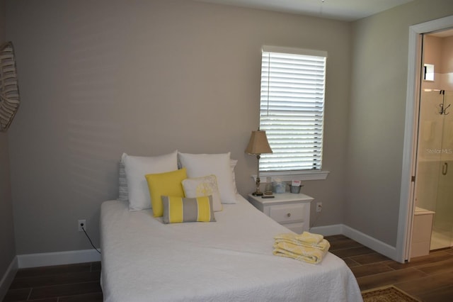 2735 Lavandula Ct, North Port, FL 34289 - bedroom featuring baseboards, wood tiled floor, and ensuite bath