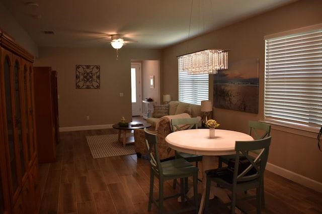 2735 Lavandula Ct, North Port, FL 34289 - dining room with baseboards, ceiling fan with notable chandelier, wood finished floors, and visible vents