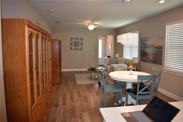 2735 Lavandula Ct, North Port, FL 34289 - dining space with baseboards, ceiling fan with notable chandelier, recessed lighting, and wood finished floors