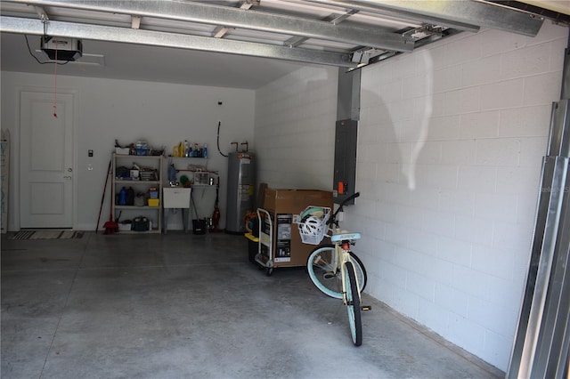 2735 Lavandula Ct, North Port, FL 34289 - garage with a garage door opener, concrete block wall, and electric water heater