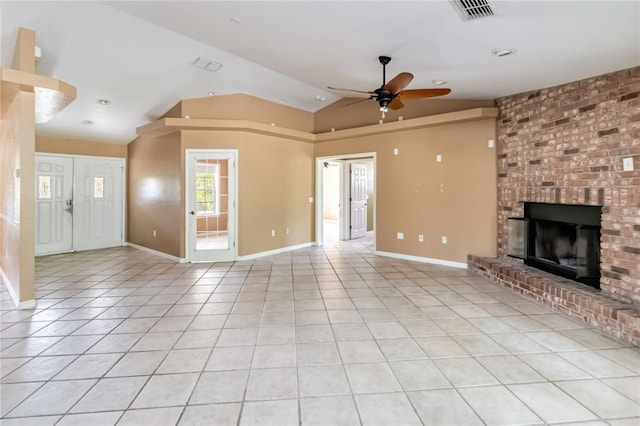 unfurnished living room featuring a brick fireplace, ceiling fan, visible vents, and lofted ceiling