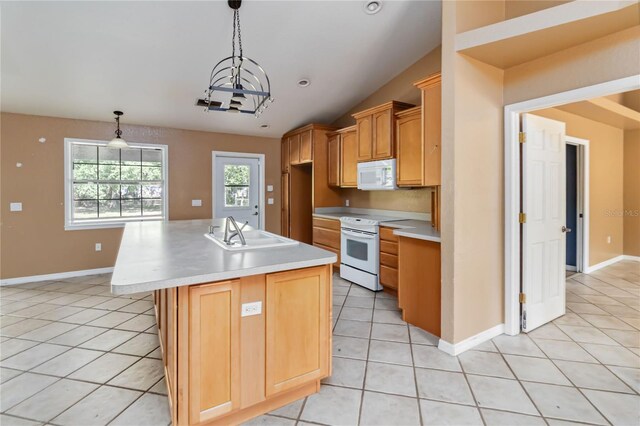 kitchen featuring white appliances, light tile patterned flooring, a sink, and light countertops