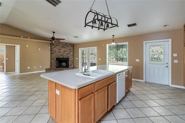 kitchen with a ceiling fan, visible vents, a fireplace, dishwasher, and light tile patterned flooring