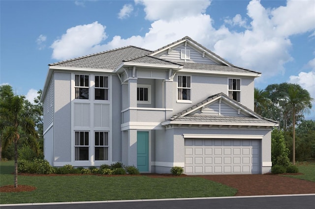 view of front of property with stucco siding, a front lawn, driveway, and a tiled roof