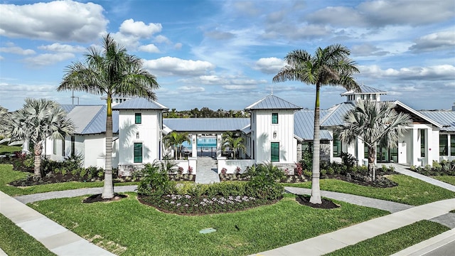 17212 Savory Mist Cir, Lakewood Ranch, FL 34211 - view of front facade with a standing seam roof, metal roof, and a front yard