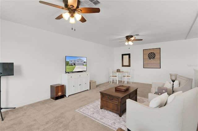1940 Bell Creek Loop, Fruitland Park, FL 34731 - living area with a ceiling fan and light carpet