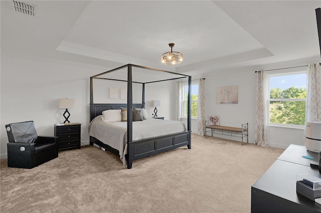 1940 Bell Creek Loop, Fruitland Park, FL 34731 - bedroom with a raised ceiling, light carpet, ornamental molding, a chandelier, and baseboards