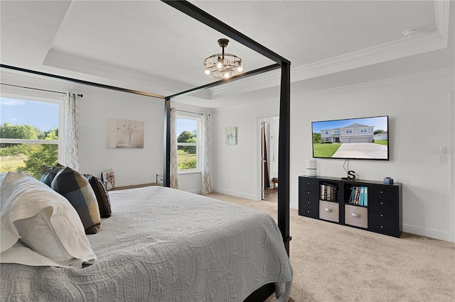 1940 Bell Creek Loop, Fruitland Park, FL 34731 - carpeted bedroom with a tray ceiling, ornamental molding, baseboards, and a chandelier