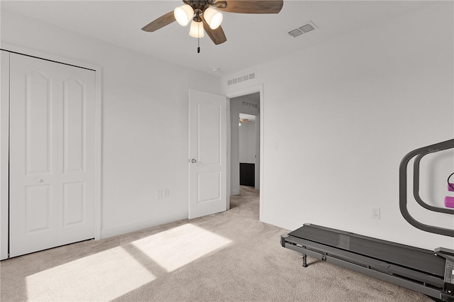 1940 Bell Creek Loop, Fruitland Park, FL 34731 - workout area featuring carpet flooring, ceiling fan, and baseboards