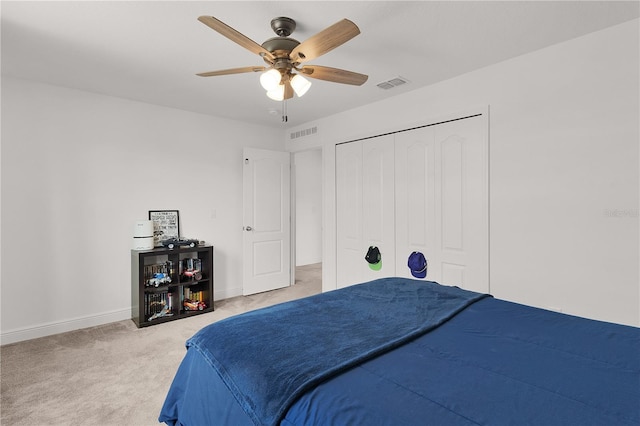 1940 Bell Creek Loop, Fruitland Park, FL 34731 - bedroom featuring light colored carpet, baseboards, a ceiling fan, and a closet