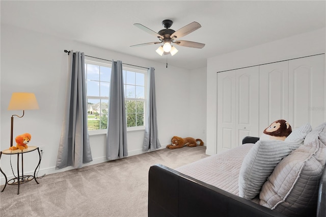 1940 Bell Creek Loop, Fruitland Park, FL 34731 - carpeted bedroom with baseboards, a closet, and ceiling fan