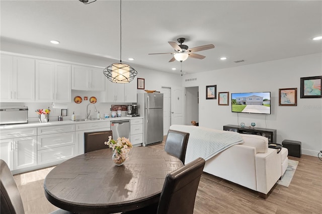 1940 Bell Creek Loop, Fruitland Park, FL 34731 - dining area with recessed lighting, ceiling fan, light wood-type flooring, and baseboards