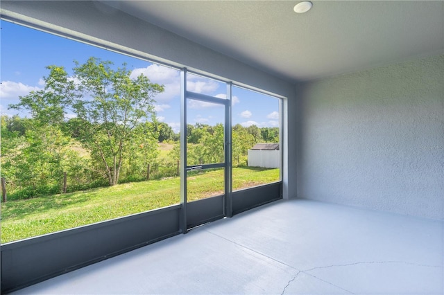 1940 Bell Creek Loop, Fruitland Park, FL 34731 - unfurnished sunroom with view of scattered trees