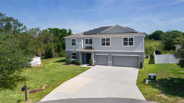 1940 Bell Creek Loop, Fruitland Park, FL 34731 - view of front of property featuring a garage, solar panels, concrete driveway, and stucco siding